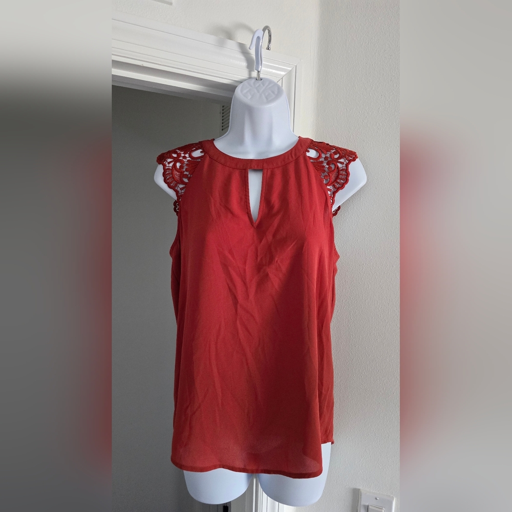 Express top with open back and lace sleeves